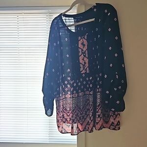 A black pink bohemian blouse with pearl buttons.
